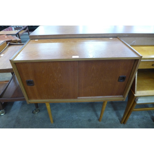 42 - A teak two door record cabinet