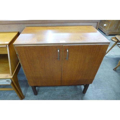 44 - A teak two door record cabinet