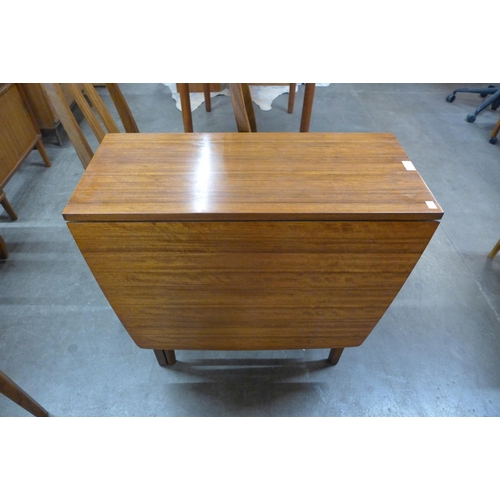 53 - A Nathan teak drop-leaf table and four chairs