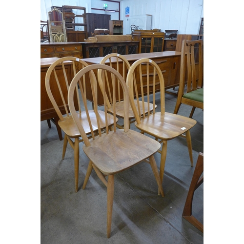 55 - A set of four Ercol Blonde elm and beech Windsor chairs