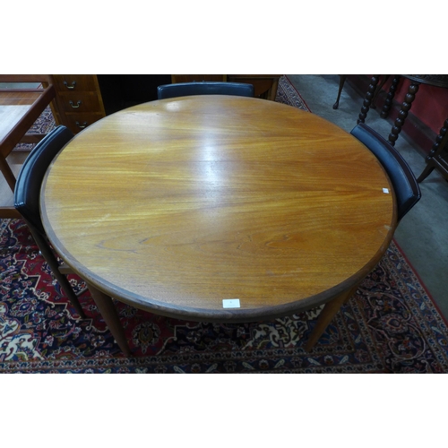 6 - A G-Plan Fresco teak circular extending dining table and four chairs