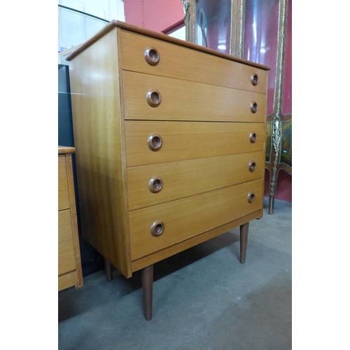 64 - A teak chest of drawers