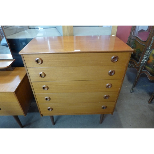 64 - A teak chest of drawers