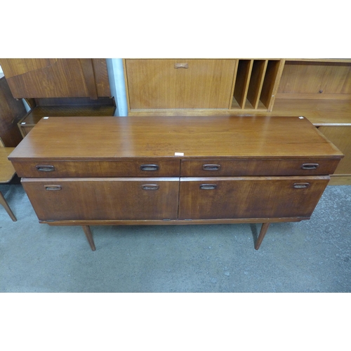 76 - A teak small sideboard