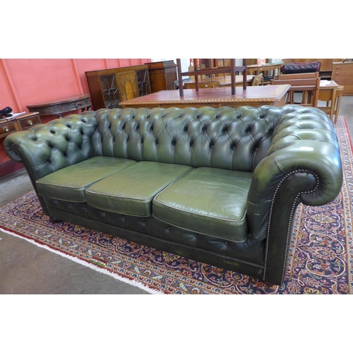 91 - A green leather Chesterfield settee