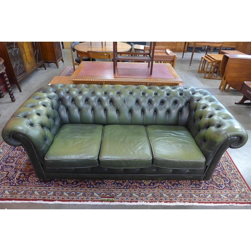 91 - A green leather Chesterfield settee