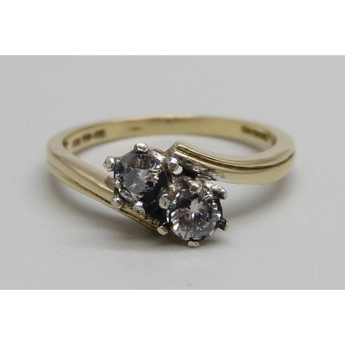 1012 - A 14ct gold, two stone diamond crossover ring, 2.7g, O