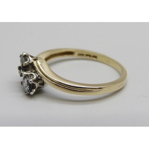 1012 - A 14ct gold, two stone diamond crossover ring, 2.7g, O