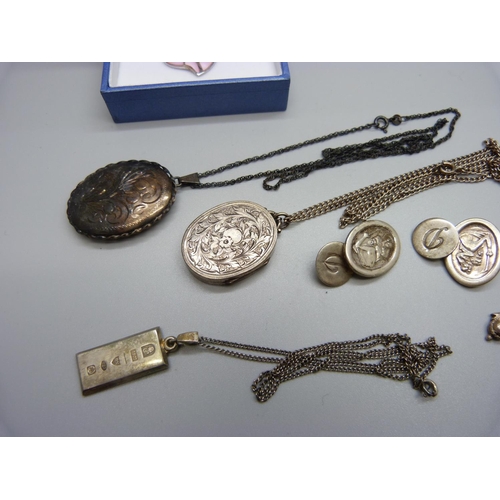 1016 - A silver locket, one other locket, a pair of silver cufflinks, a cross pendant and two pendants on c... 