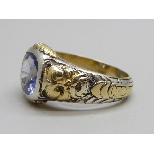 1019 - A yellow and white metal ring set with a topaz stone, 11g, V