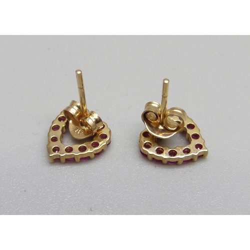 1037 - A pair of 9ct gold and ruby heart shaped earrings, 1.1g