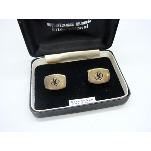 1040 - A pair of silver Midland Bank International cufflinks