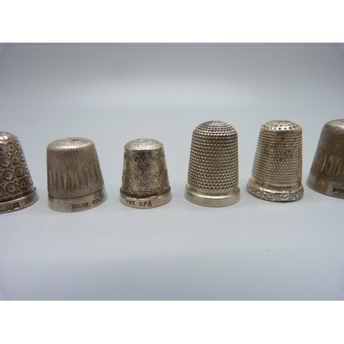 1042 - Ten silver thimbles