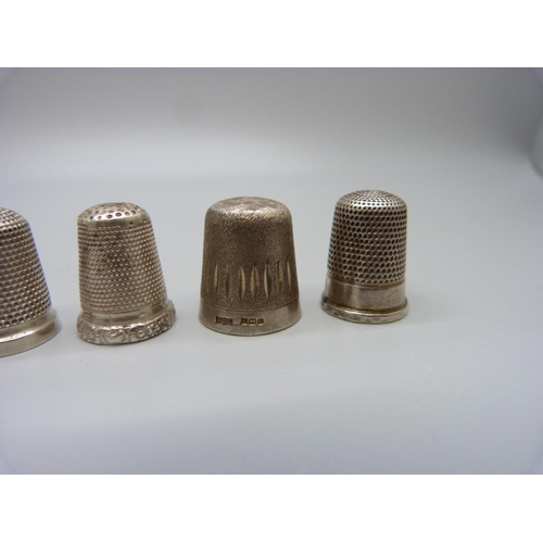 1042 - Ten silver thimbles