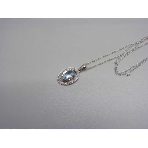 1059 - A 9ct white gold, aquamarine and diamond pendant and chain, 1.6g