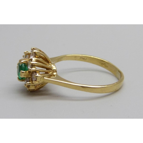 1061 - An 18ct gold, emerald and diamond ring, 2.4g, L