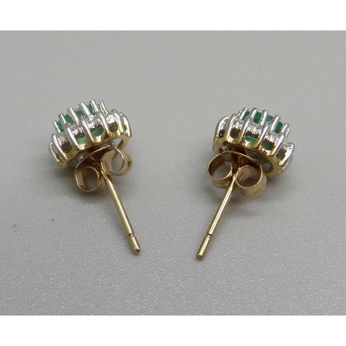 1062 - A pair of yellow metal, emerald and diamond earrings, 1.7g