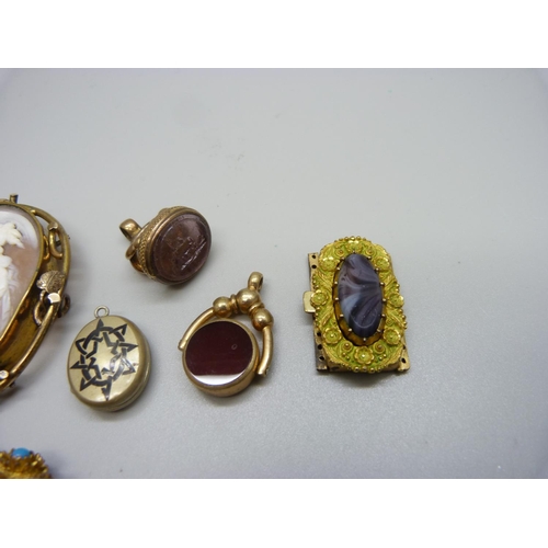 1070 - Two fobs, a large cameo brooch, lacking pin, a locket, a collar fastener, etc.