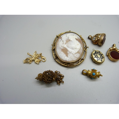 1070 - Two fobs, a large cameo brooch, lacking pin, a locket, a collar fastener, etc.