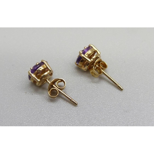 1079 - A pair of 9ct gold and amethyst earrings