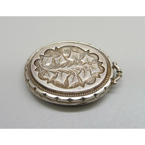 1084 - A Victorian white metal locket, lacking loop, 20g, 33mm wide