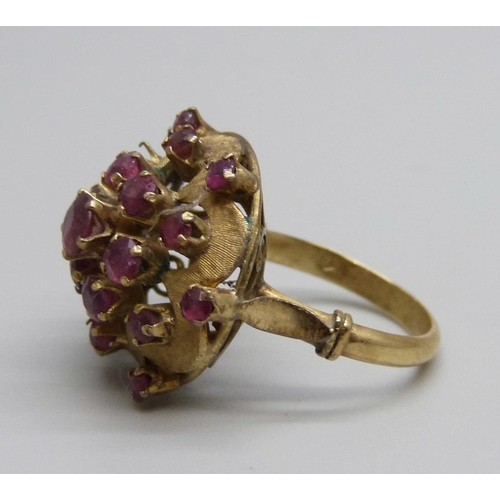 1088 - A 14ct gold and ruby cluster ring, two stones missing, 5.9g, M