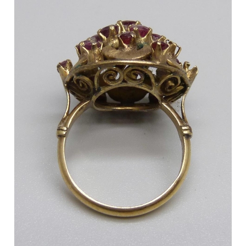 1088 - A 14ct gold and ruby cluster ring, two stones missing, 5.9g, M