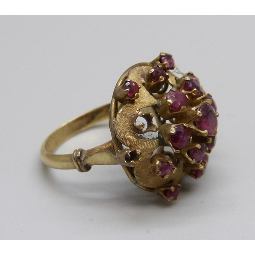 1088 - A 14ct gold and ruby cluster ring, two stones missing, 5.9g, M