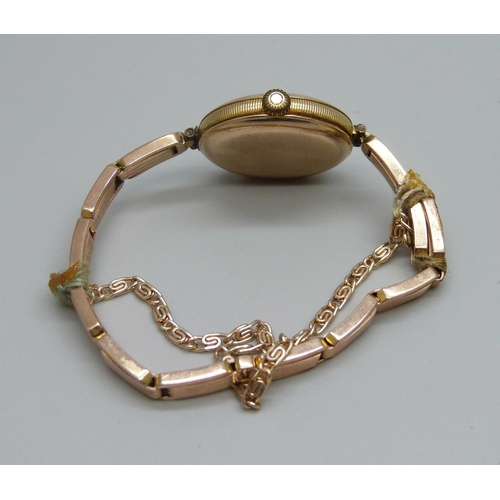 1091 - A lady's 9ct gold Rolex wristwatch on a 9ct gold expanding bracelet strap, London import mark for 19... 