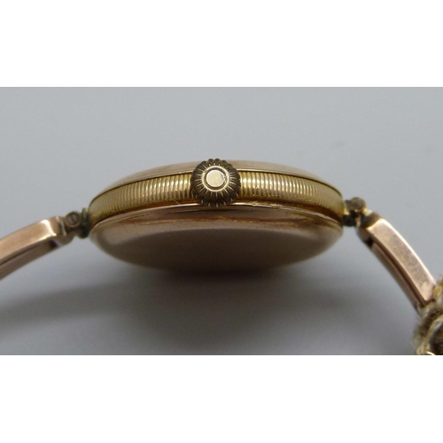 1091 - A lady's 9ct gold Rolex wristwatch on a 9ct gold expanding bracelet strap, London import mark for 19... 