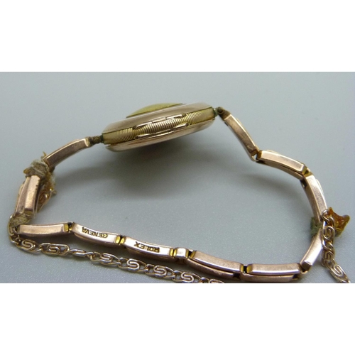 1091 - A lady's 9ct gold Rolex wristwatch on a 9ct gold expanding bracelet strap, London import mark for 19... 