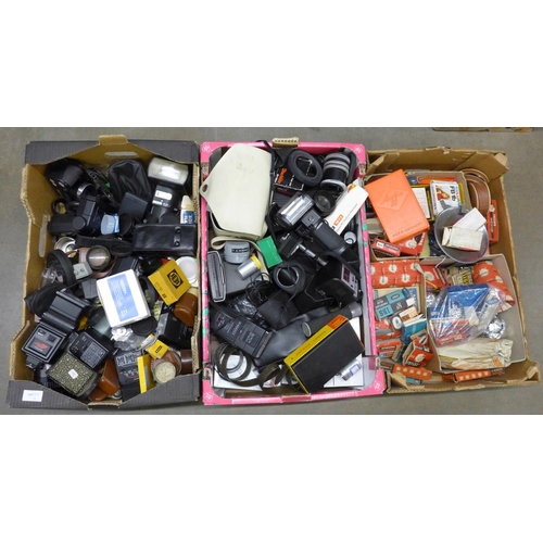 1120 - Three boxes of cameras and accessories, including flash guns, bulbs etc. **PLEASE NOTE THIS LOT IS N... 