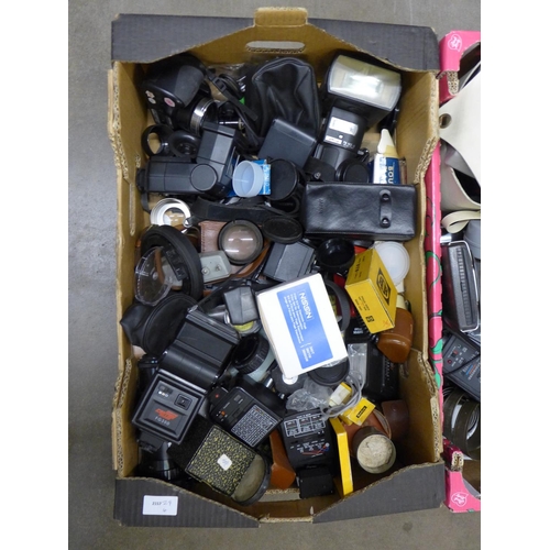 1120 - Three boxes of cameras and accessories, including flash guns, bulbs etc. **PLEASE NOTE THIS LOT IS N... 