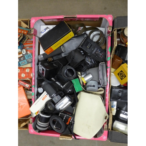 1120 - Three boxes of cameras and accessories, including flash guns, bulbs etc. **PLEASE NOTE THIS LOT IS N... 