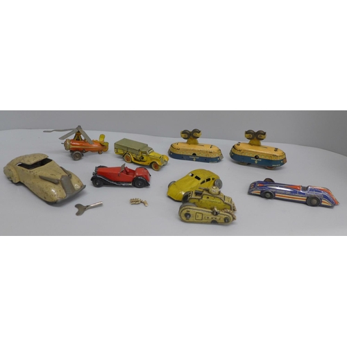 616 - Eight tin-plate model vehicles including clockwork and a Dinky Toys classic car