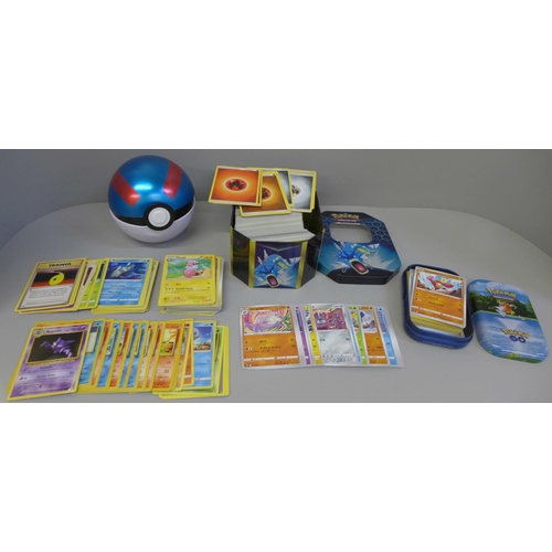 657 - 500 Assorted Pokemon cards including collector tins