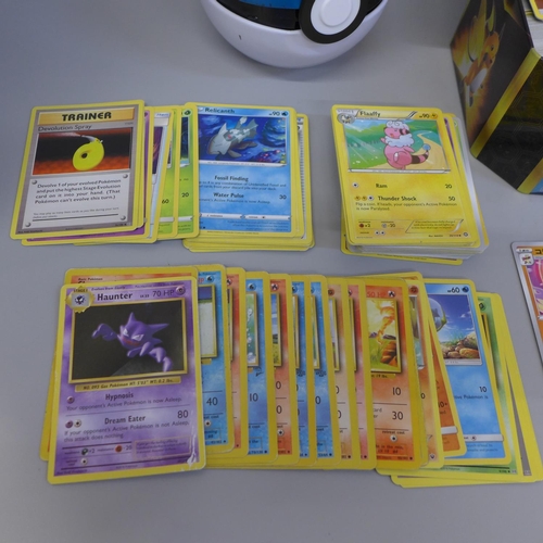 657 - 500 Assorted Pokemon cards including collector tins