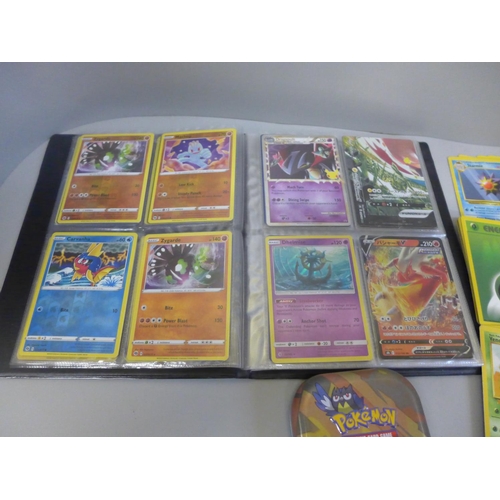 668 - 130 Holo/Rev Holo Pokemon cards in album and collectors tin and cards