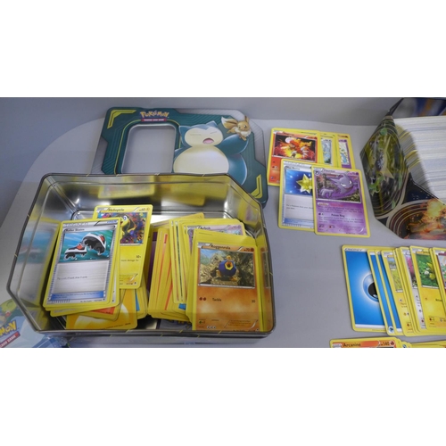 675 - 650 Assorted Pokemon cards including collector tins