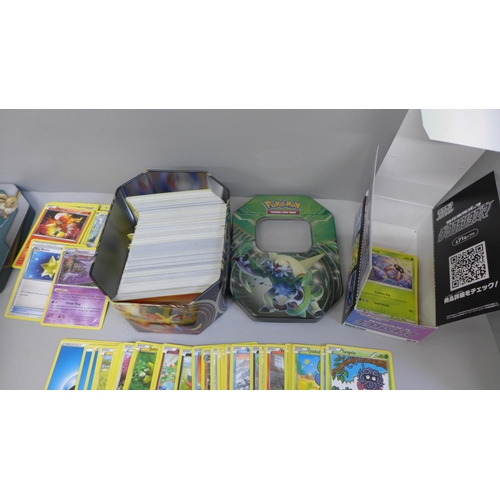 675 - 650 Assorted Pokemon cards including collector tins