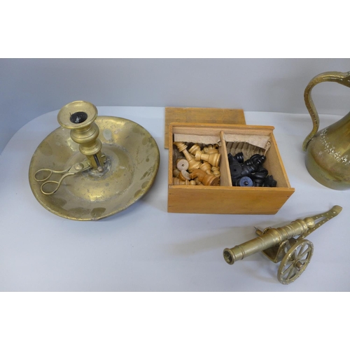 677 - A boxed wooden chess set, a Persian brass tea pot, chamber stick and cannon, cannon a/f