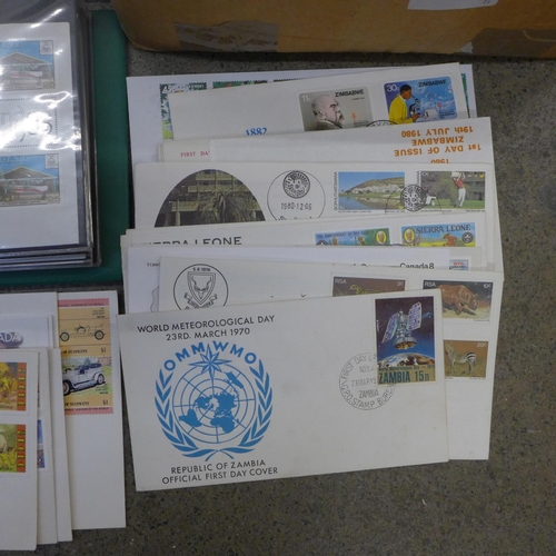 692 - Stamps; a box of worldwide first day covers in albums and loose