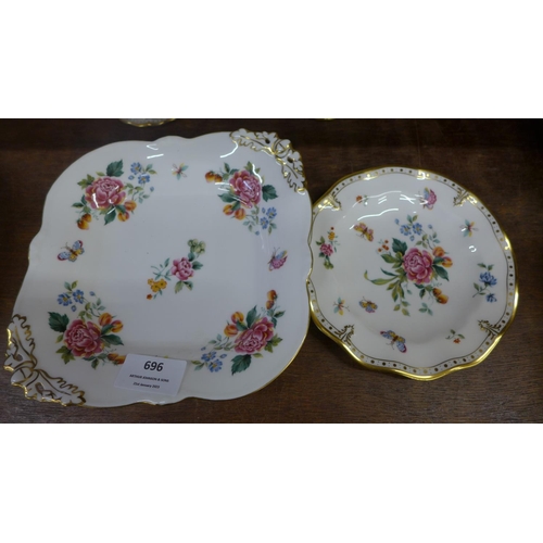 696 - A Royal Crown Derby Days serving plate, one other plate, sugar basin with lid, cream jug and tea pla... 