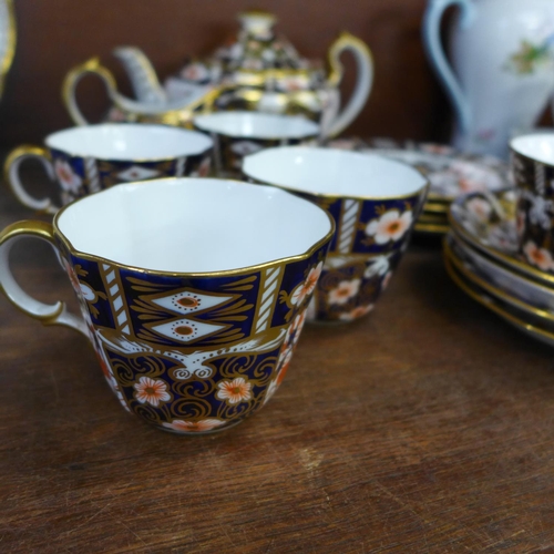 697 - A Royal Crown Derby 2451 four setting tea set with tea pot, cream and sugar bowl