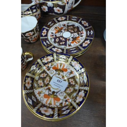 697 - A Royal Crown Derby 2451 four setting tea set with tea pot, cream and sugar bowl