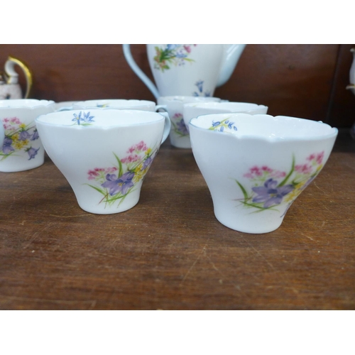 698 - A Shelley Wild Flowers six setting coffee set, (no sugar bowl)