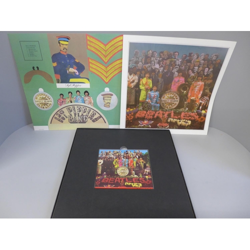 702 - A Beatles related Peter Blake autographed Sgt. Pepper CD boxed set