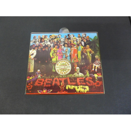 702 - A Beatles related Peter Blake autographed Sgt. Pepper CD boxed set