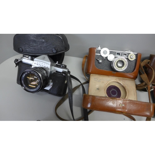 762 - A collection of three cameras and a meter, includes Argus Cintar and Asahi Pentax