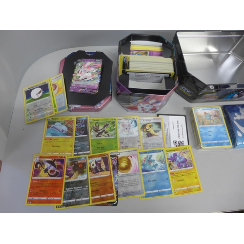 767 - Assorted Pokemon cards with Holos and collector tins